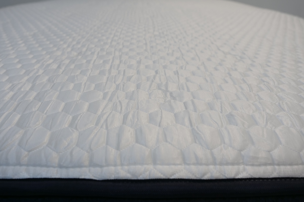 A close-up of mattress topper fabric.