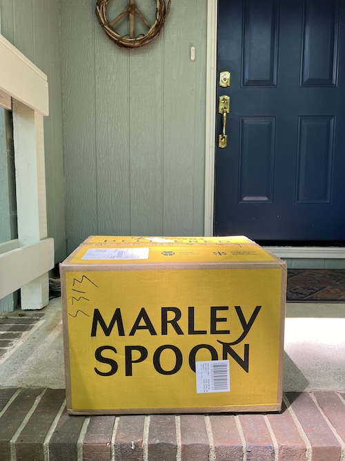 A Marley Spoon box on a doorstep