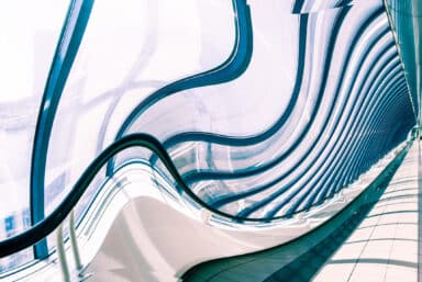 Warped view of glazed corridor in office center